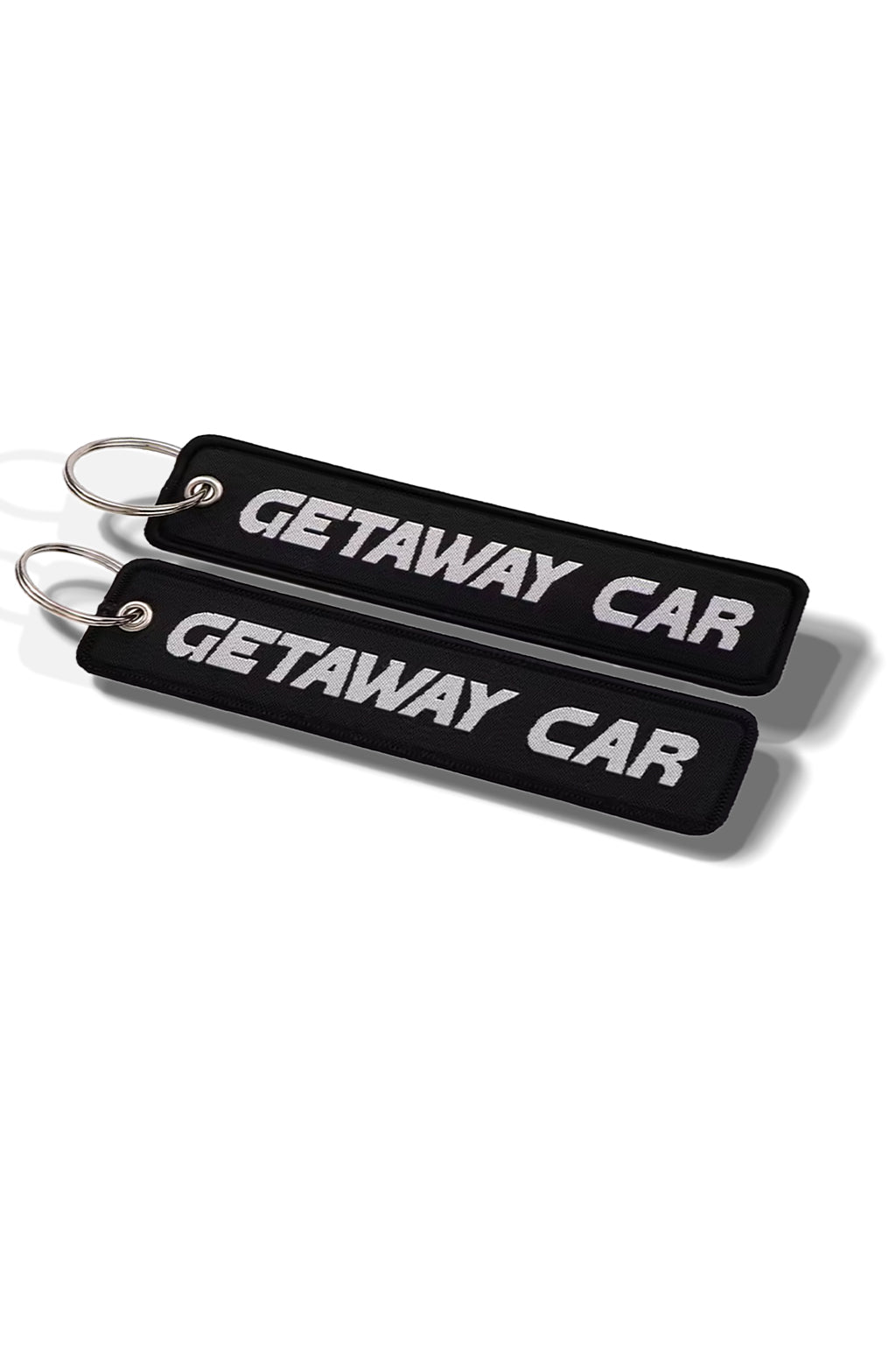 Key with 'Getaway Car' keychain on a car seat