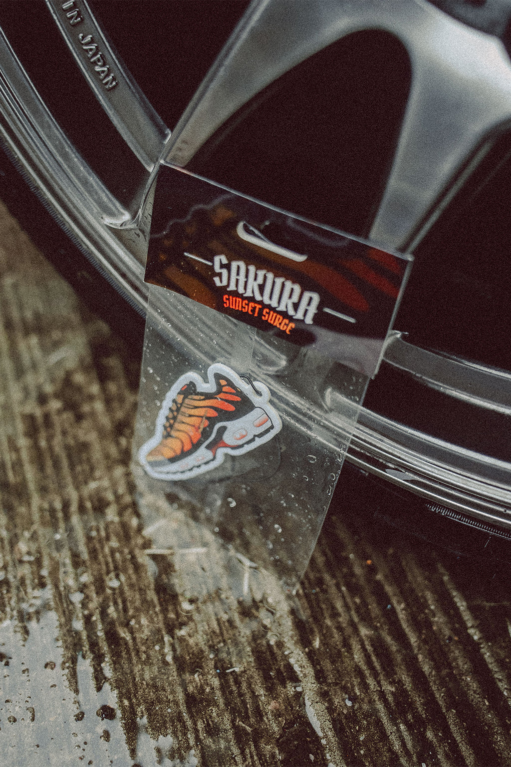 Sakura TN Air Freshener placed on some offroad tyres