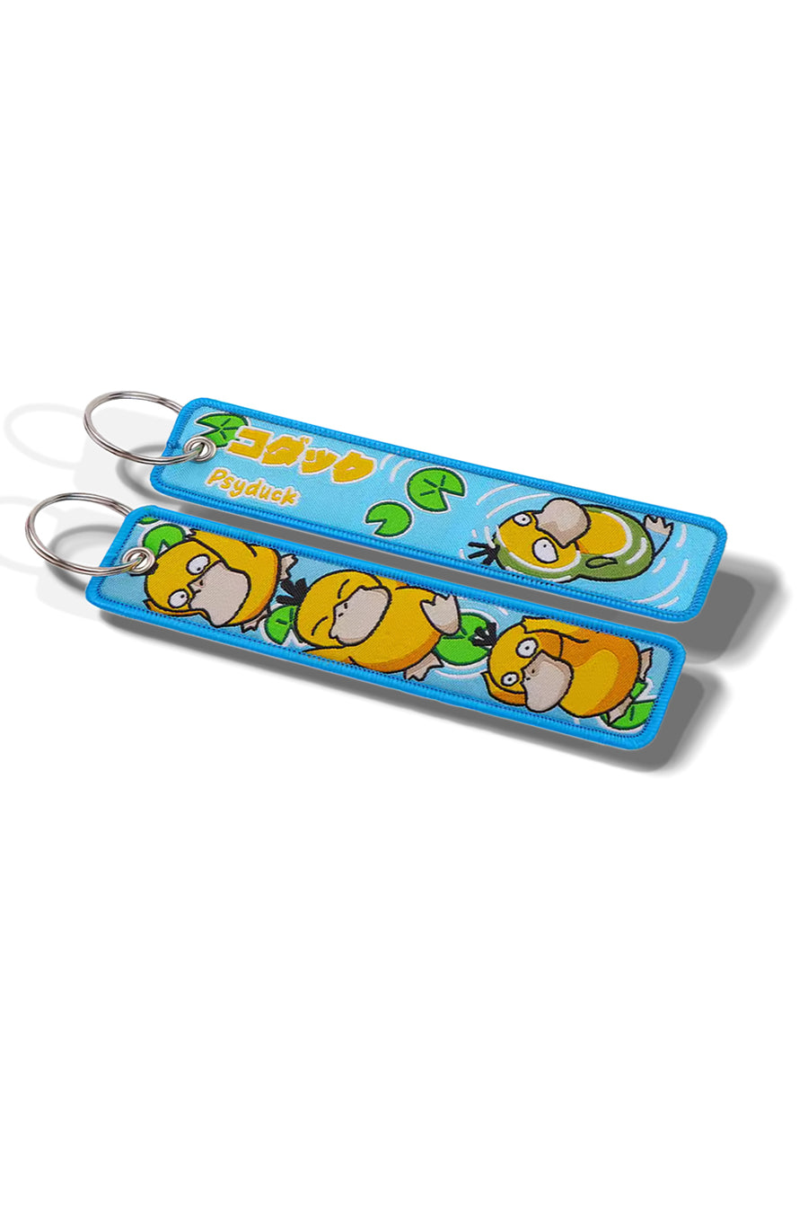 Two cartoon character keychains on a white background