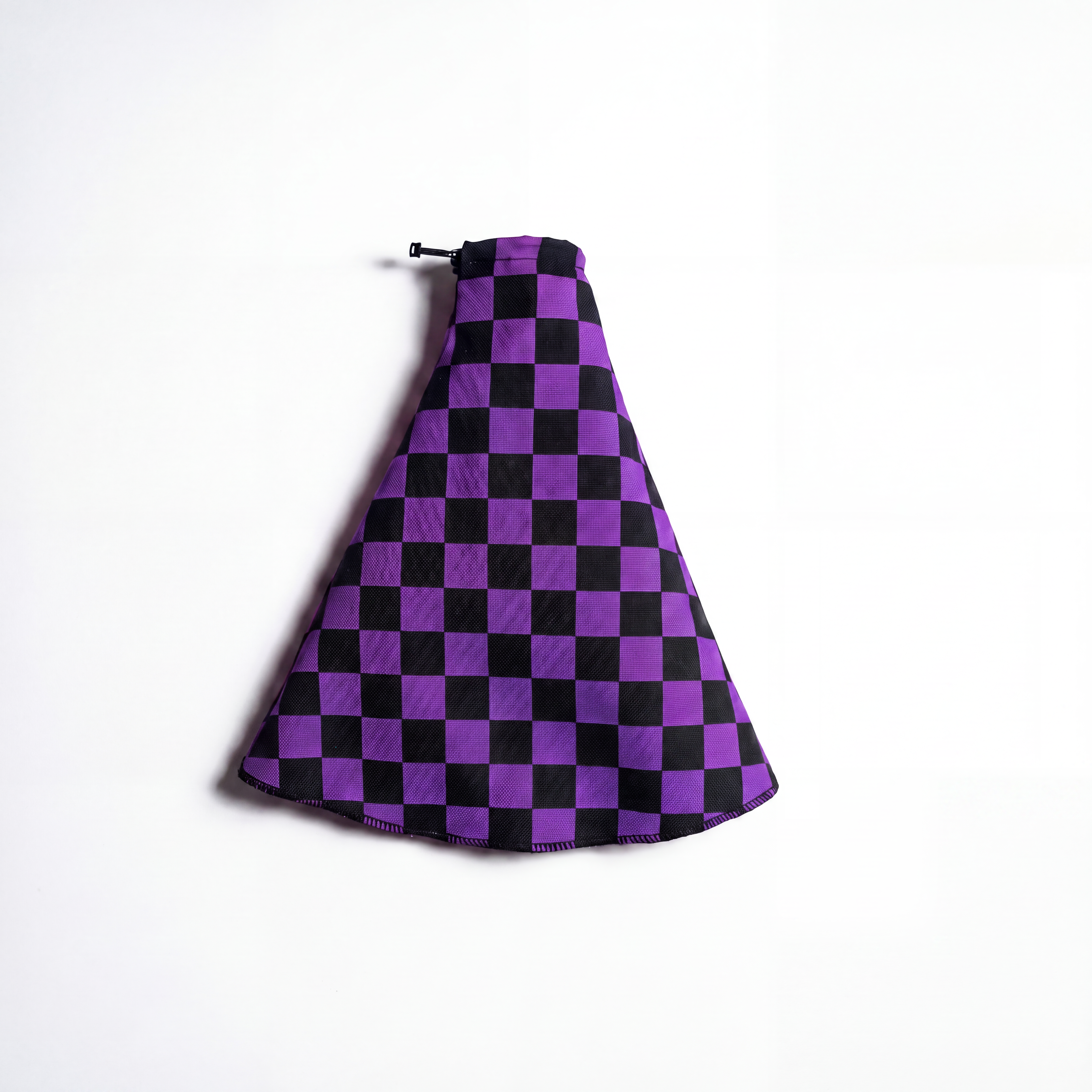 A car shift boot or gaiter. Checked 90s purple shift boot showcase against white background